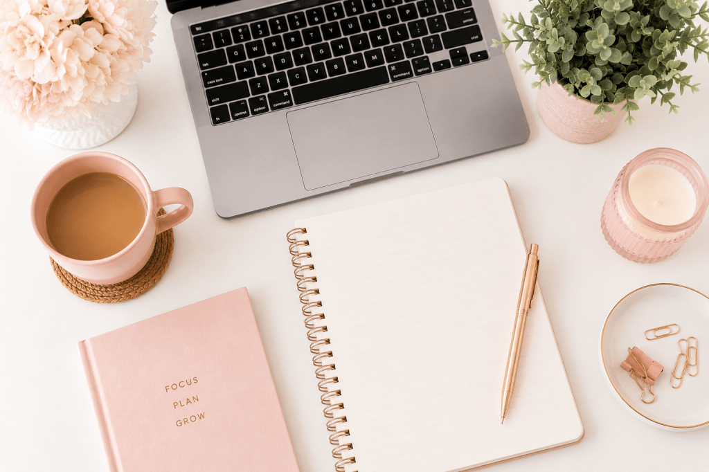 beginner work from home job options for moms — organized desk with laptop and notebook